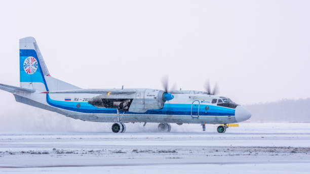 Kostroma Air Enterprise Antonov An-26B-100 Kostroma Air Enterprise Antonov An-26B-100, RA-26133, taxiing from the stand. Pulkovo International Airport, Saint-Petersburg, Russia. 26 December 2020 antonov an 26 stock pictures, royalty-free photos & images