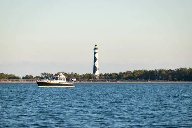 The Cape Lookout Lighthouse at Cape Lookout, North Carolina, viewed from the water.
