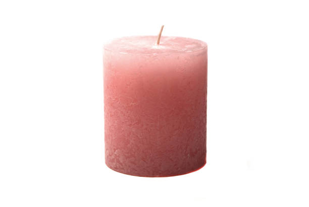 istock Pink cylindrical wax candle, isolate on a white background. Side view. 1294052584