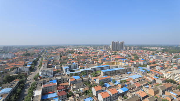 istock Aerial panoramic view of cityscape, town under blue sky 1294054220