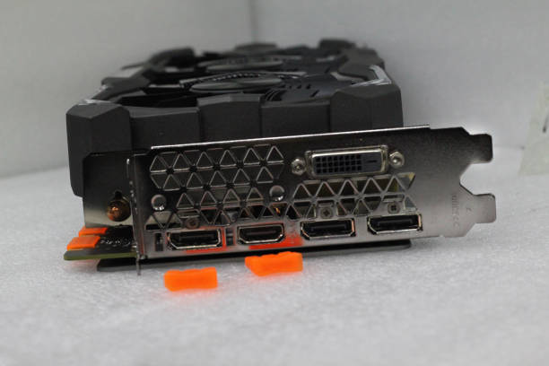 istock Computer graphics card for playing high-level games. These graphics cards have multiple fans. In addition, this display port, HDMI port and DVI ports are available. 1294055917