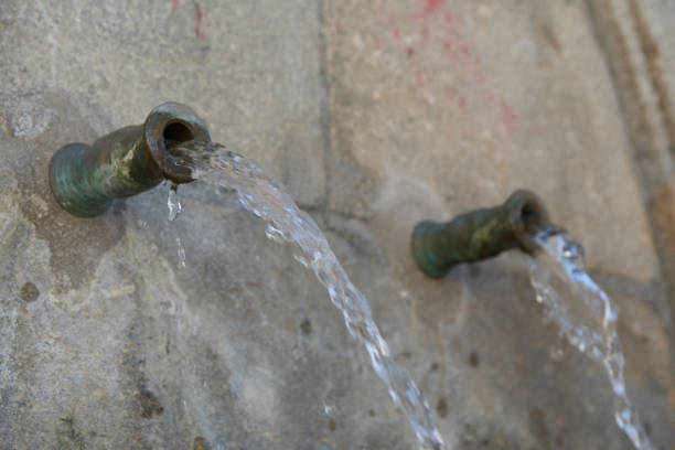 istock old stone natural water fountain 1294056734