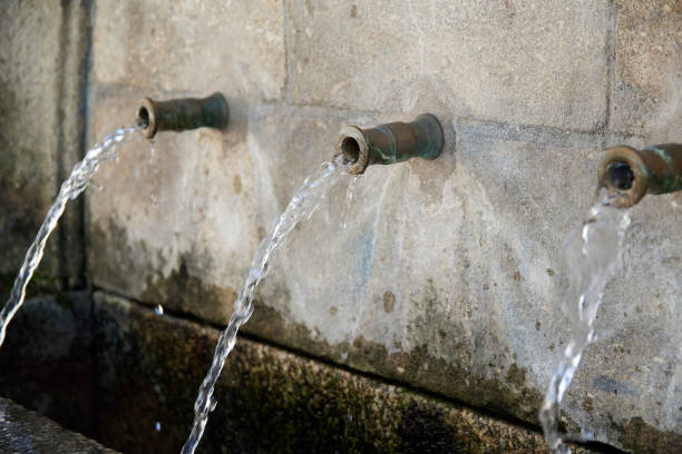 istock Old natural water Fountain with three pipes 1294056735