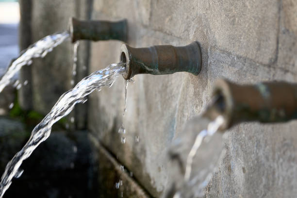 istock Old natural water Fountain with three pipes 1294056736