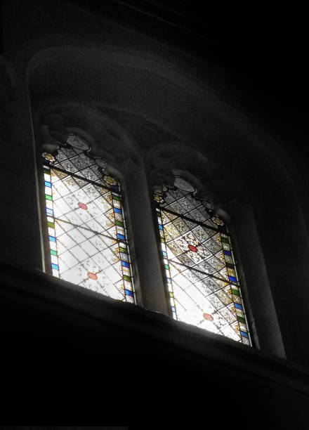 istock old stained glass church windows in a dark interior with light shining through 1294060004