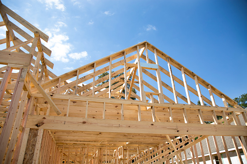 New homes construction site.   Framed house.  Lumber,  Building.  One story home.