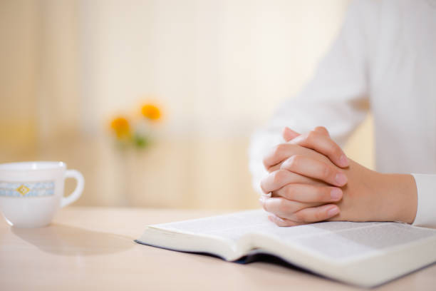 istock Praying woman, coronavirus pandemic, isolation, copy space 1294060770
