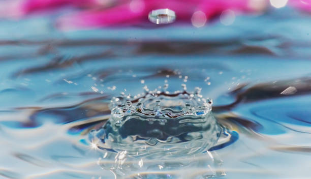 istock Water drops liquid, water splash, colorful abstract water wave texture, selective focus 1294061387