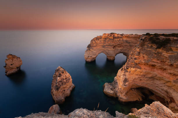 Praia da Marinha cove with the famous heart formation of the natural archs at Algarve, Portugal. Praia da Marinha cove with the famous heart formation of the natural archs at Algarve, Portugal. praia da marinha stock pictures, royalty-free photos & images
