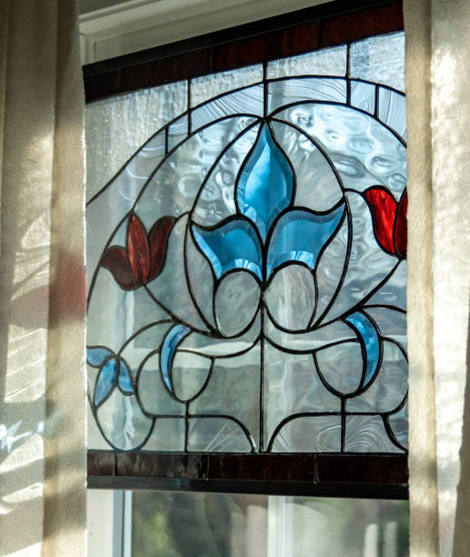 istock Light coming in through a blue and red stained glass window with curtains 1294061646