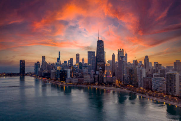 Dramatic View of the Chicago at Sunset Aerial View of Chicago cityscape along Lake Shore Drive at dusk lake shore drive chicago stock pictures, royalty-free photos & images