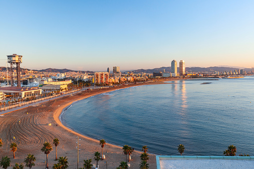 Aerial panoramic view on Barceloneta Beach, Barcelona, Spain in the early morning