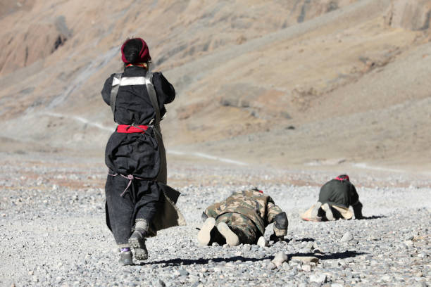 Pilgrim on the way to Mount Kailash, Tibet Pilgrim is on the way from their home town to the holy Mount Kailash, Tibet. There are thousands of pilgrims fulfill their faith by walking and kowtowing thousands of kilometer. Tibetan Border Police stock pictures, royalty-free photos & images