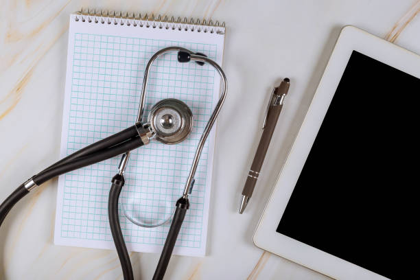 istock Digital tablet computer with medical stethoscope on marble table on the medical office hospital 1294070586