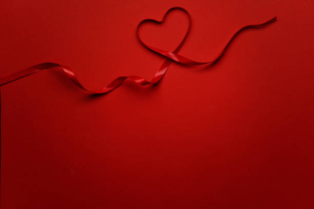istock Heart Shaped Red Ribbon 1294073517