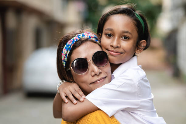 istock Happy mother and daughter holding each other. 1294080437