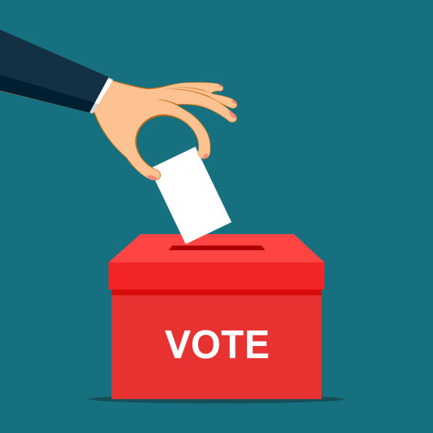 istock hand putting paper in the ballot box. Voting concept in flat style 1294083314