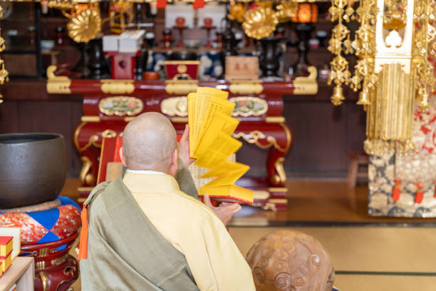 istock Japanese monk praying at a temple 1294091698