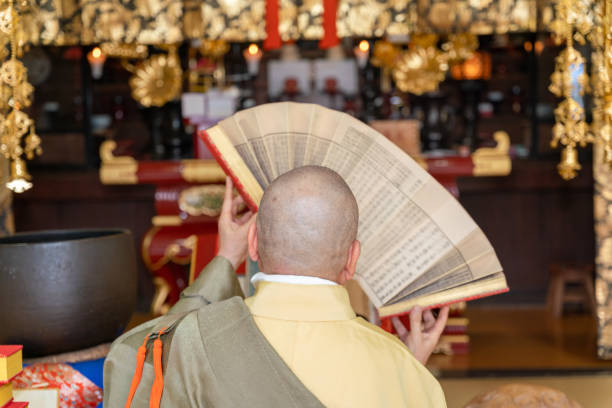 istock Japanese monk praying at a temple 1294091706