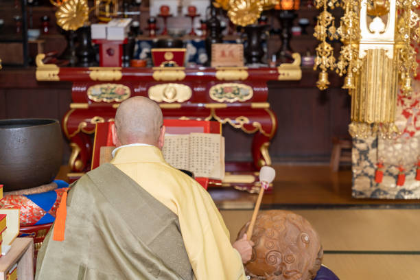 istock Japanese monk praying at a temple 1294091729