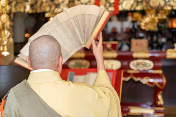 istock Japanese monk praying at a temple 1294091733
