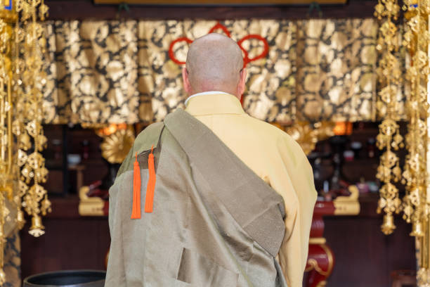 istock Japanese monk praying at a temple 1294091734