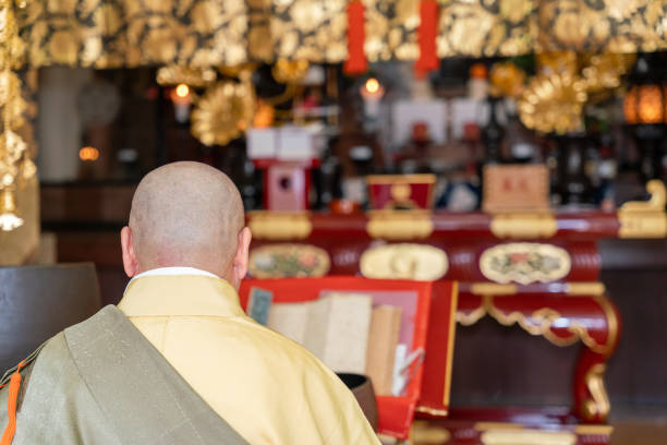 istock Japanese monk praying at a temple 1294091735