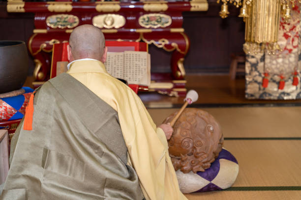 istock Japanese monk praying at a temple 1294091738
