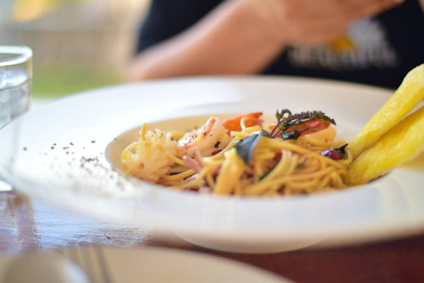 istock Close up spaghetti on white plate in resterant. 1294092498