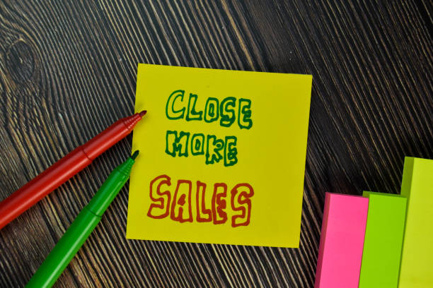 istock Close More Sales write on sticky note isolated on Wooden Table. Business concept 1294093841