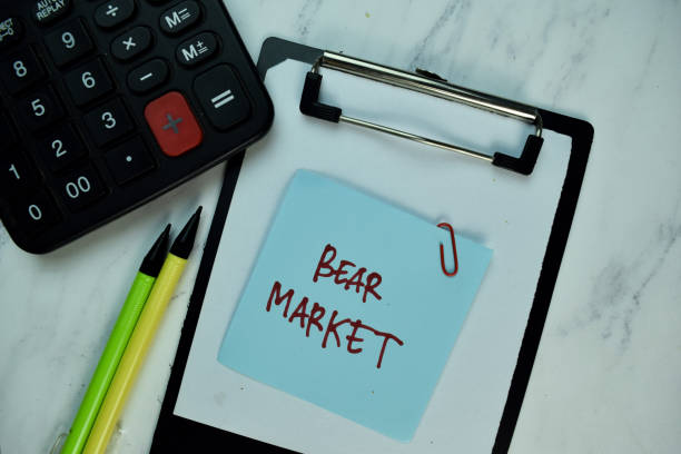 istock Bear Market write on sticky note isolated on Wooden Table. Business concept 1294093932