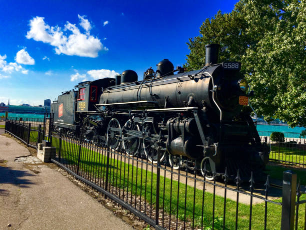 An old railroad steam locomotive on track.