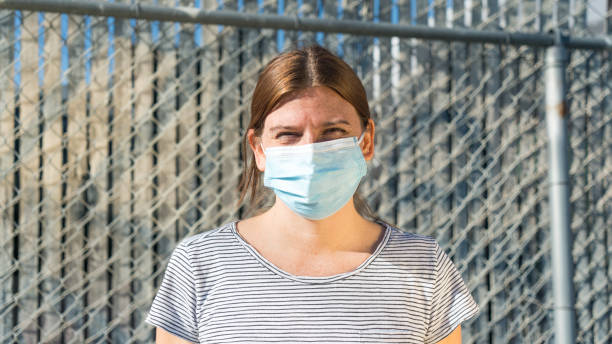 istock A woman smiles under her mask 1294095533