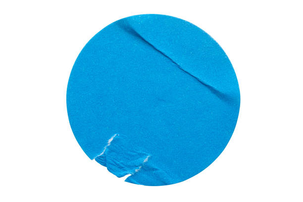 istock Blank blue round adhesive paper sticker label isolated on white background 1294101819