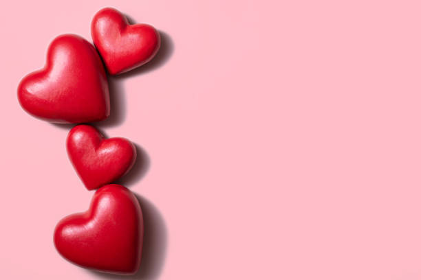 istock Valentine day composition with red hearts, photo template on pink background. 1294104010