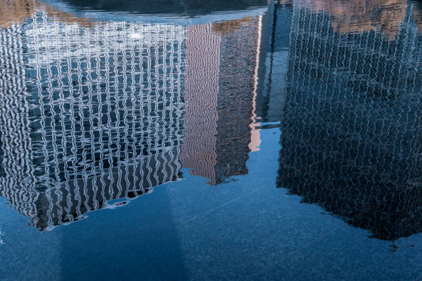 istock Building reflected on the surface of the water 1294104589