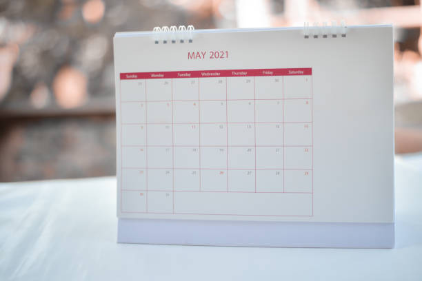istock White calendar on blur background planning concept. 1294106943