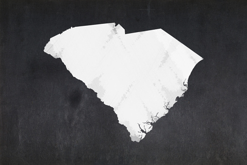 Blackboard with a the map of the State of South Carolina (USA) drawn in the middle.