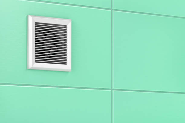 Exhaust fan mounted on the tiles in the bathroom
