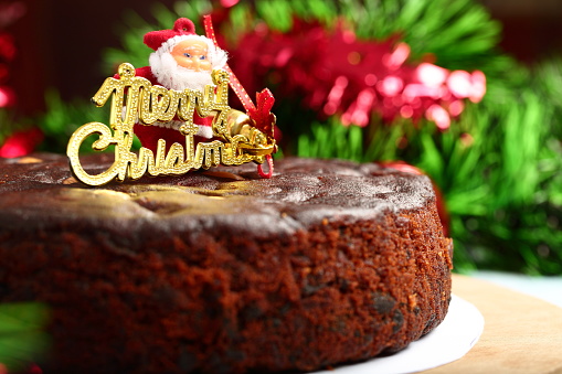 Homemade fresh chocolate sponge cake- Christmas celebrations background.