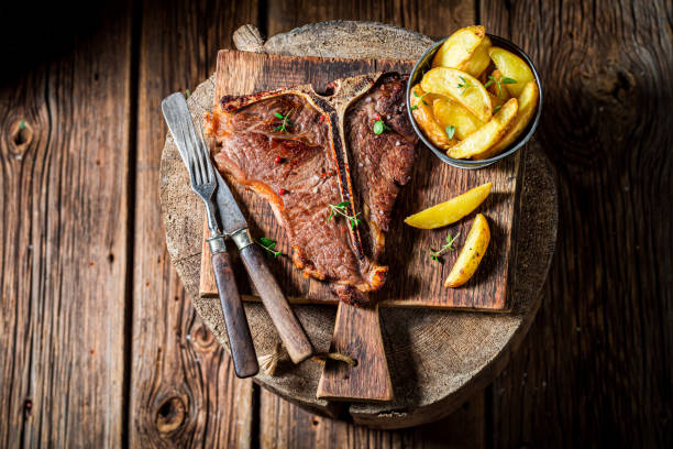 istock Delicious chips and wellp done tbone steak 1294115668