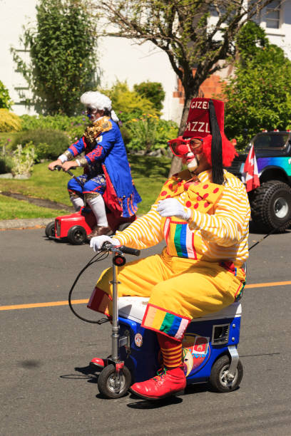 Victoria Day parade Tea Party Victoria Cabada May. 23, 2016: Shriners in funny outfit from across Canada and USA in the Victoria Day parade - Tea Party -. This is Victoria's largest parade, attracting well over 100,000 people.. shriners stock pictures, royalty-free photos & images