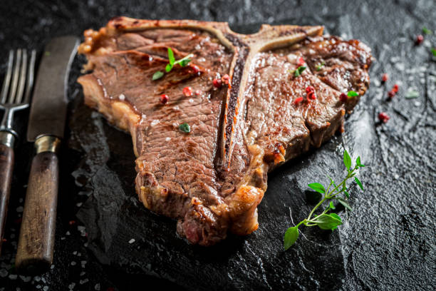 istock Closeup of well done tbone steak with chips 1294116828