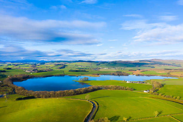 The aerial view of a Scottish loch in Dumfries and Galloway on a bright winter morning The view from a drone of a loch in south west Scotland on a calm bright sunny day Galloway Hills stock pictures, royalty-free photos & images