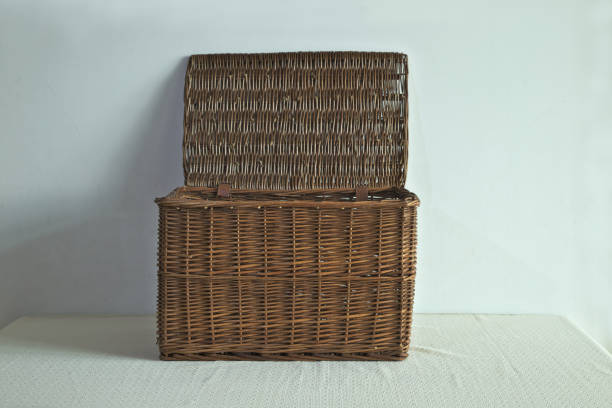 istock An open wicker basket isolated on a white background, storage box 1294119007
