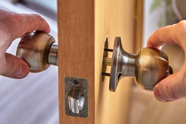 istock Fixing the loose doorknob or door handle. 1294120707