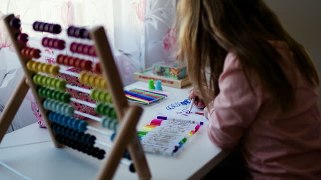 Kids paint. Child painting rainbow. Little girl drawing