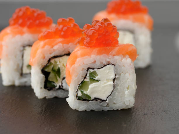 istock Philadelphia sushi with red caviar on a black slate board 1294124974