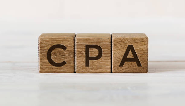 istock Three wooden cubes - letters CPA meaning COST PER ACTION on them. 1294126499