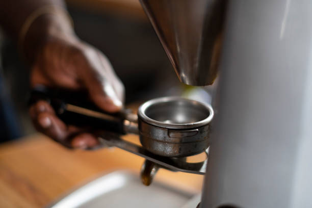 istock Close up empty portafilter on coffee bean grinder 1294131783